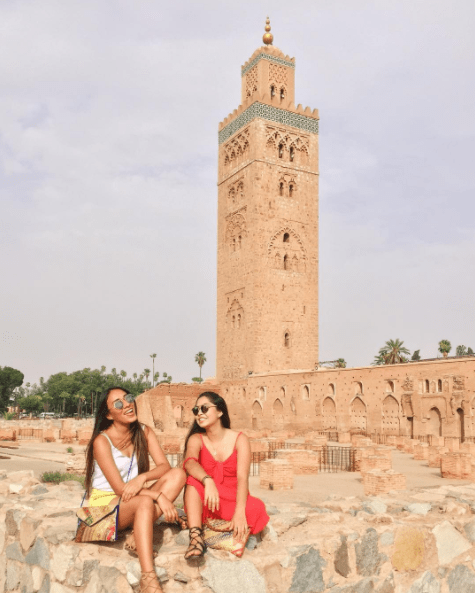 Yoa and Maria outside of the Koutoubia Mosque in Marrakech, Morocco